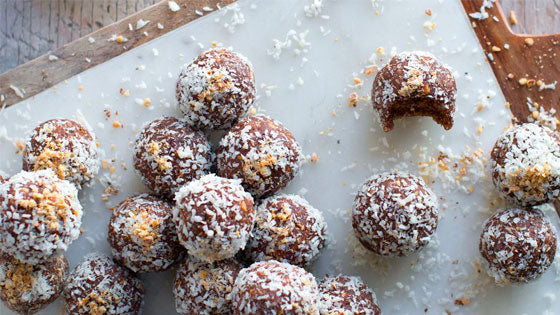 Keto Coconut Protein Bites on a table.