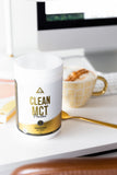 Levelup clean MCT powder on a desk with a latte